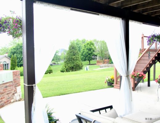 How to create outdoor oasis - DIY under deck outdoor curtains - white mesh curtain panels for outdoor space - This is our Bliss