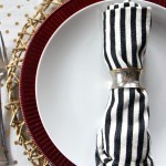 gold polka dot - red ruffle charger plate - black and ivory striped napkin merry bright and blissful holiday home christmas table - thisisourbliss.com