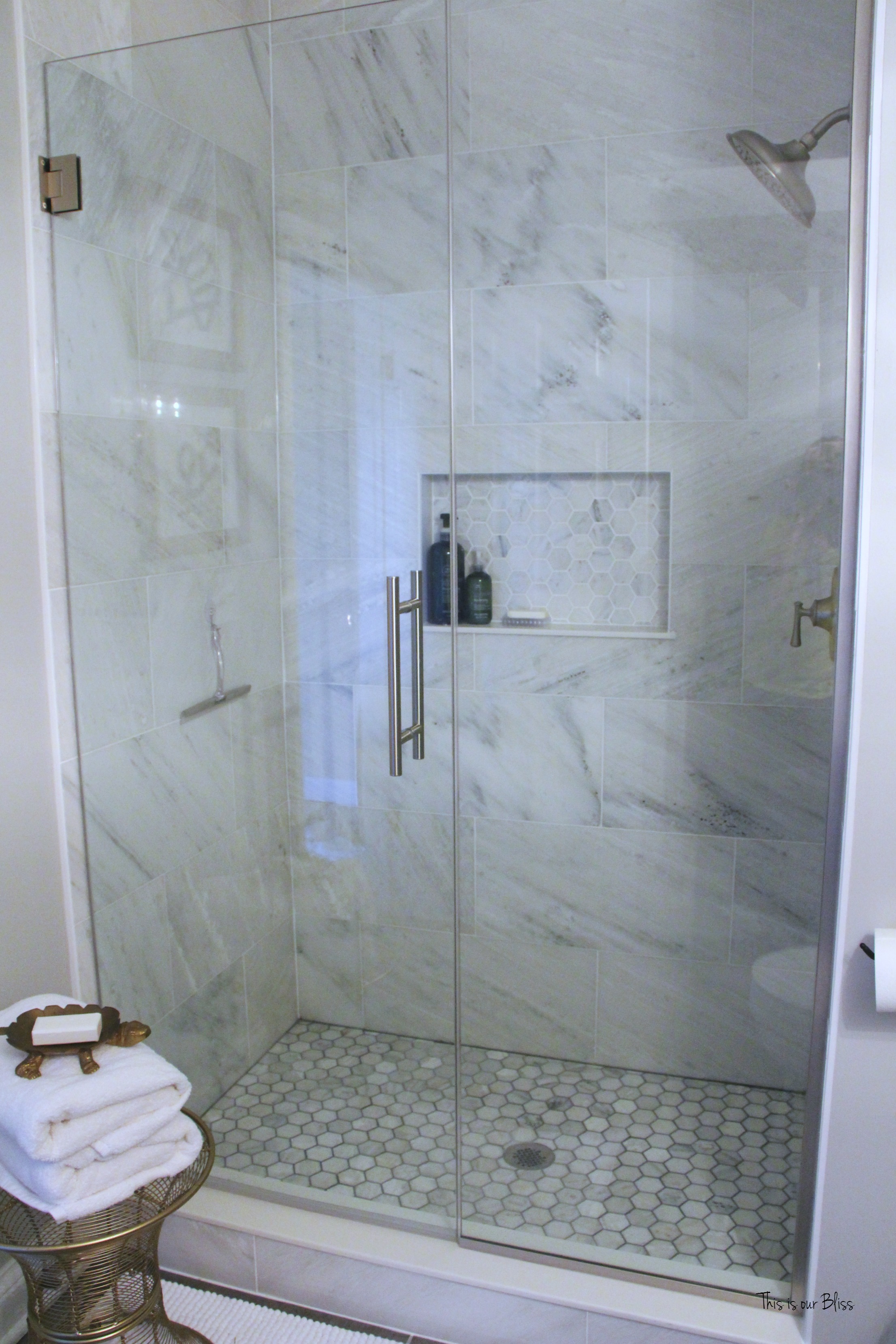https://thisisourbliss.com/wp-content/uploads/2016/04/Basement-bathroom-reveal-modern-rustic-glam-neutral-bathroom-decor-marble-shower-hexagon-tile-shower-1-This-is-our-Bliss.jpg