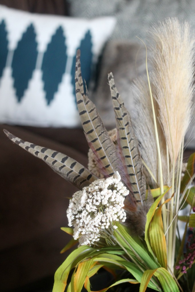 Cozy fall couch with furry fluffy throw pillows and a flannel blanket | www.thisisourbliss.com