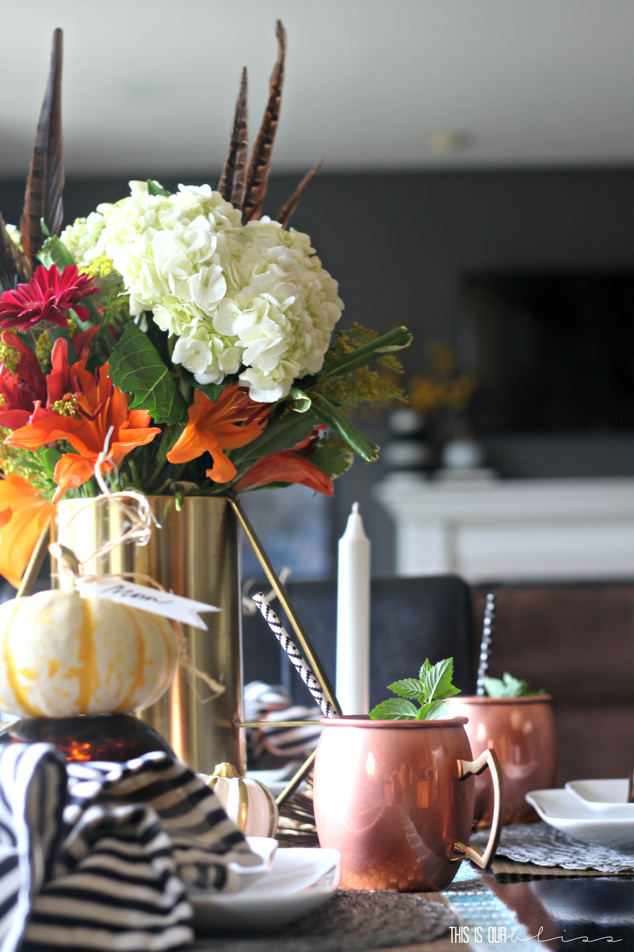 Adding a feather to your floral centerpiece instantly updates it for fall! | How to create a warm and welcoming fall tablescape | This is our Bliss | www.thisisourbliss.com
