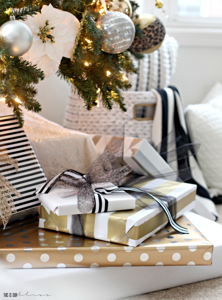 A Merry and Metallic Christmas Home | 12 Days of Holiday Homes Tour 2016: This is our Bliss Christmas Living Room | Neutral, metallic, patterned wrapped gifts || www.thisisourbliss.com