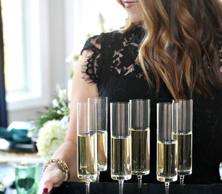 LBD with champagne flutes - the perfect little black dress for the holidays - This is our Bliss