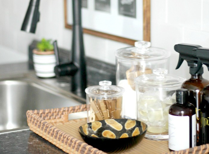 featured Organized and Chic, Small Laundry Room Update - organization ideas for your laundry room - corral everything on a tray on the counter - This is our Bliss