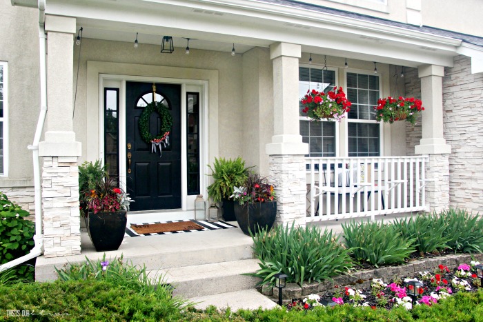Small Front Porch decorating ideas with hanging baskets and lights - This is our Bliss