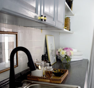 laundry sink in an organized and chic small laundry room - This is our Bliss