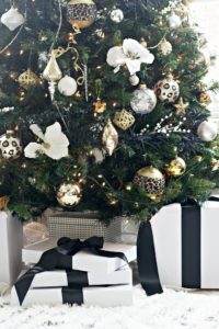 Neutral Christmas tree with black white gold and silver decorations - leopard ornaments and black and white wrapped gifts - This is our Bliss