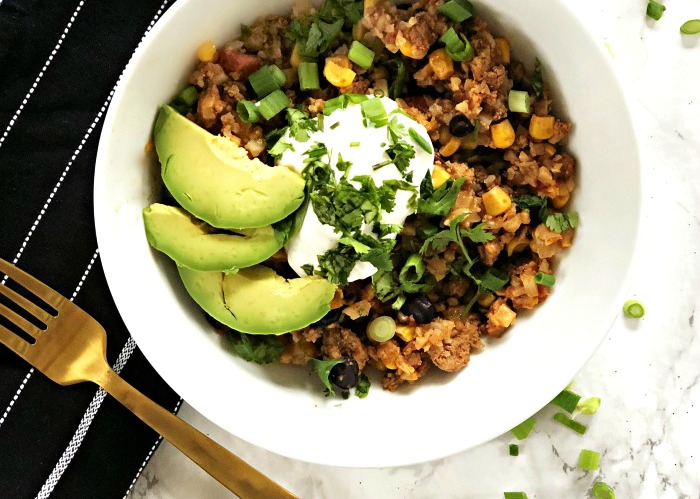 kid friendly dinner ideas -Taco Cauliflower Rice Bowls in a skillet with avocado and sour cream - My Crew Approves - This is our Bliss