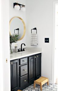 black vanity in neutral modern boys bathroom with gold and black touches - This is our Bliss