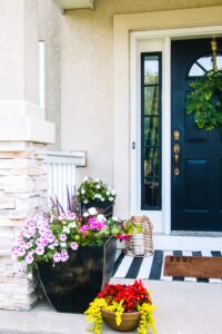 pink and red flowers on a simple small porch - Simple small porch decorating ideas for Summer