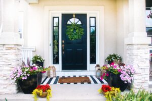 small front porch decorating ideas for Summer - colorful flowers in planters for Summer
