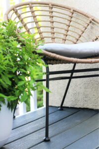 rattan chair on gray trex deck - This is our Bliss
