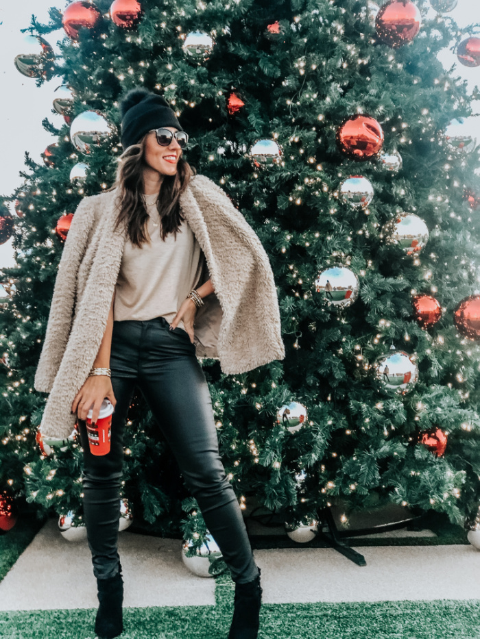 https://www.thisisourbliss.com/wp-content/uploads/2020/12/faux-fur-coat-with-black-leather-jeans-black-coated-jeggings-with-pom-pom-hat-for-the-holidays-12-days-of-Christmas-style-This-is-our-Bliss.jpg