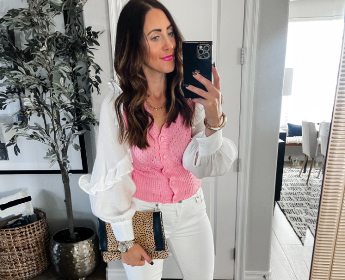 Outfit wearing pink trousers and a ruffle sleeve top