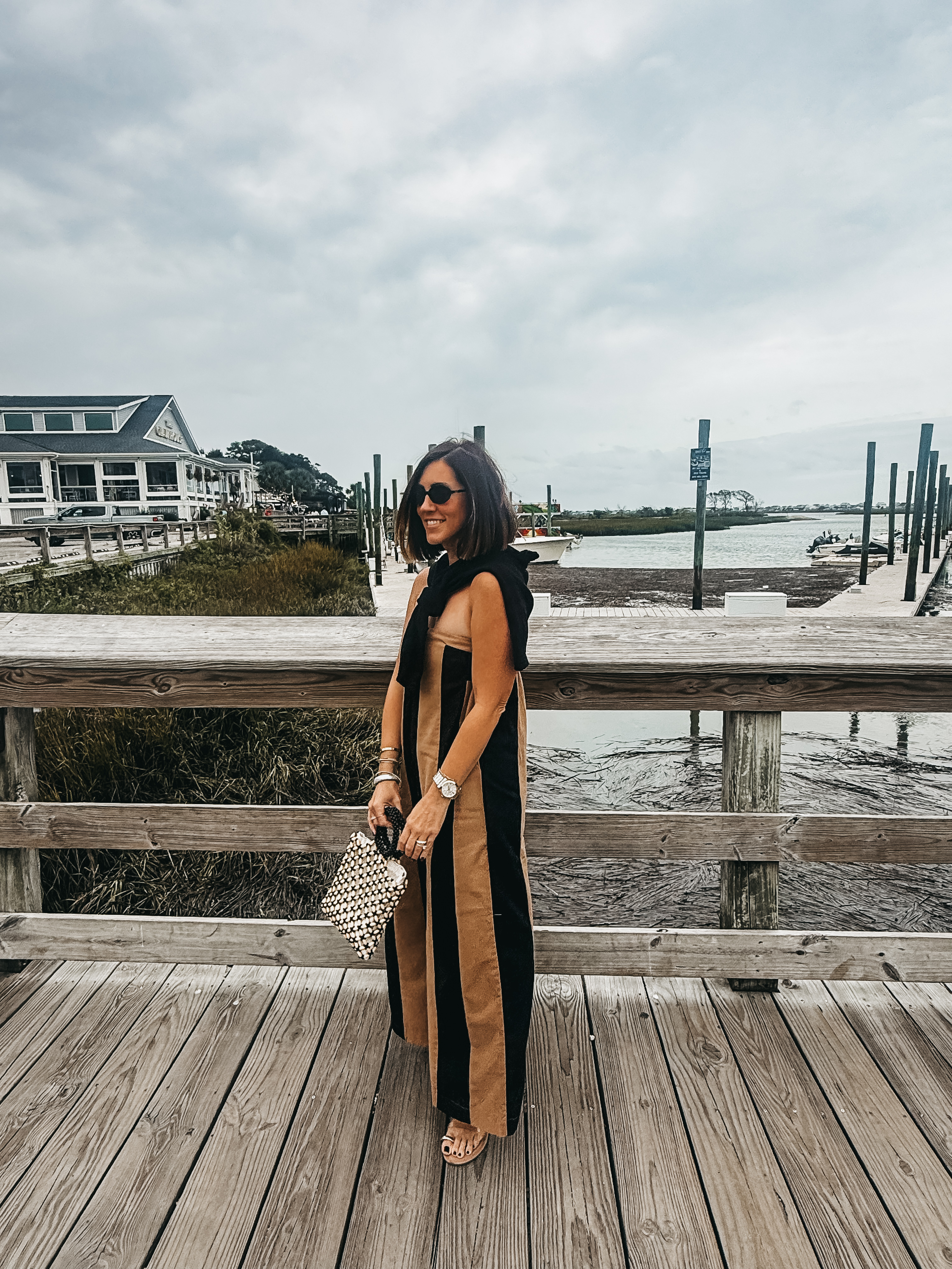 striped jumpsuit in Myrtle beach with a cardigan over the shoulders - This is our Bliss